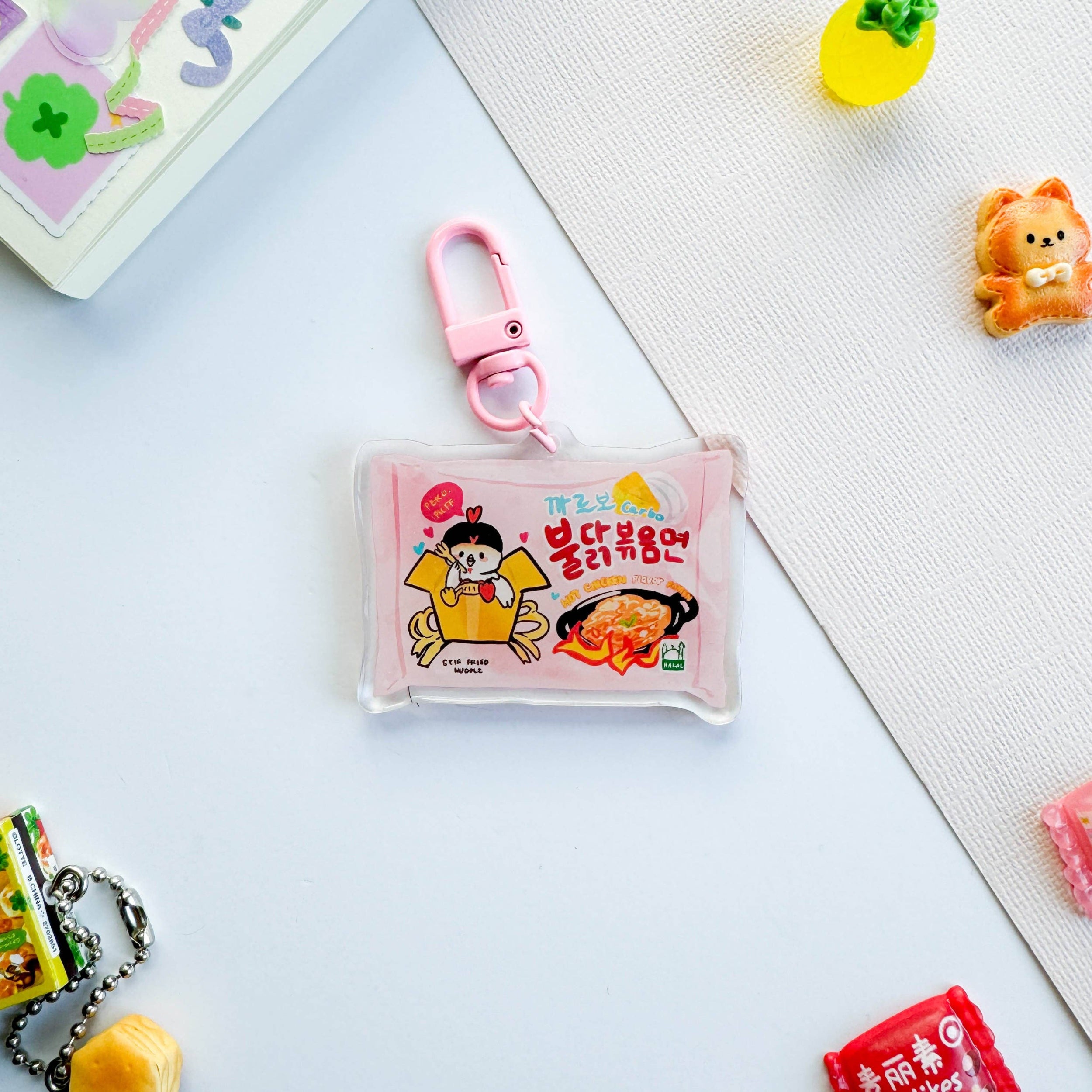 Small pouch with cartoon character and food illustration on a light blue surface