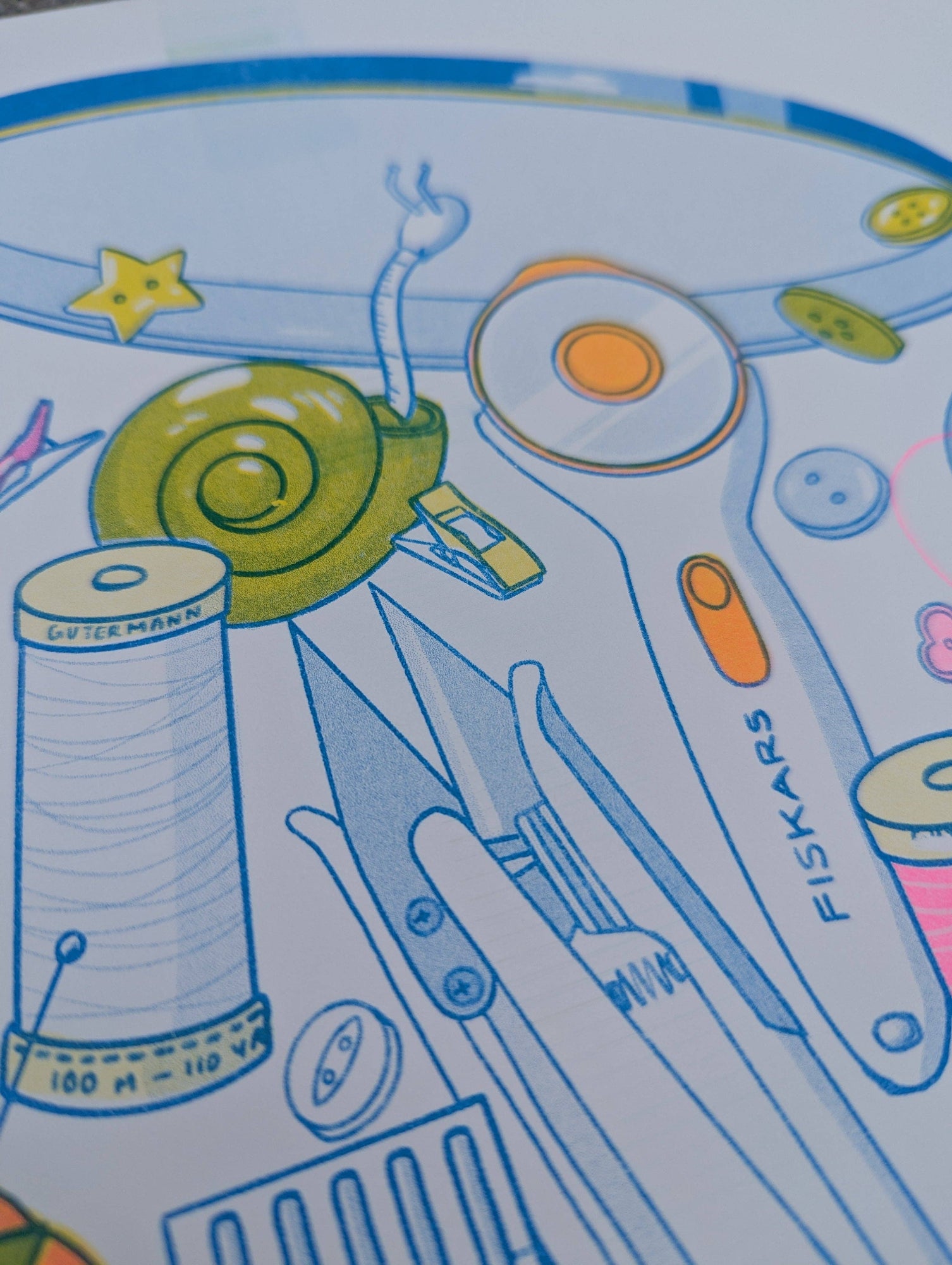 Illustration of sewing tools and materials with Fiskars branding on a colorful background, Butter Cookie Sewing Supplies Risograph Art Print, Christina Hu