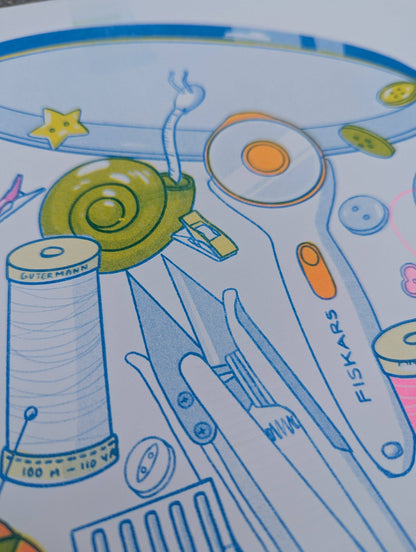 Illustration of sewing tools and materials with Fiskars branding on a colorful background, Butter Cookie Sewing Supplies Risograph Art Print, Christina Hu