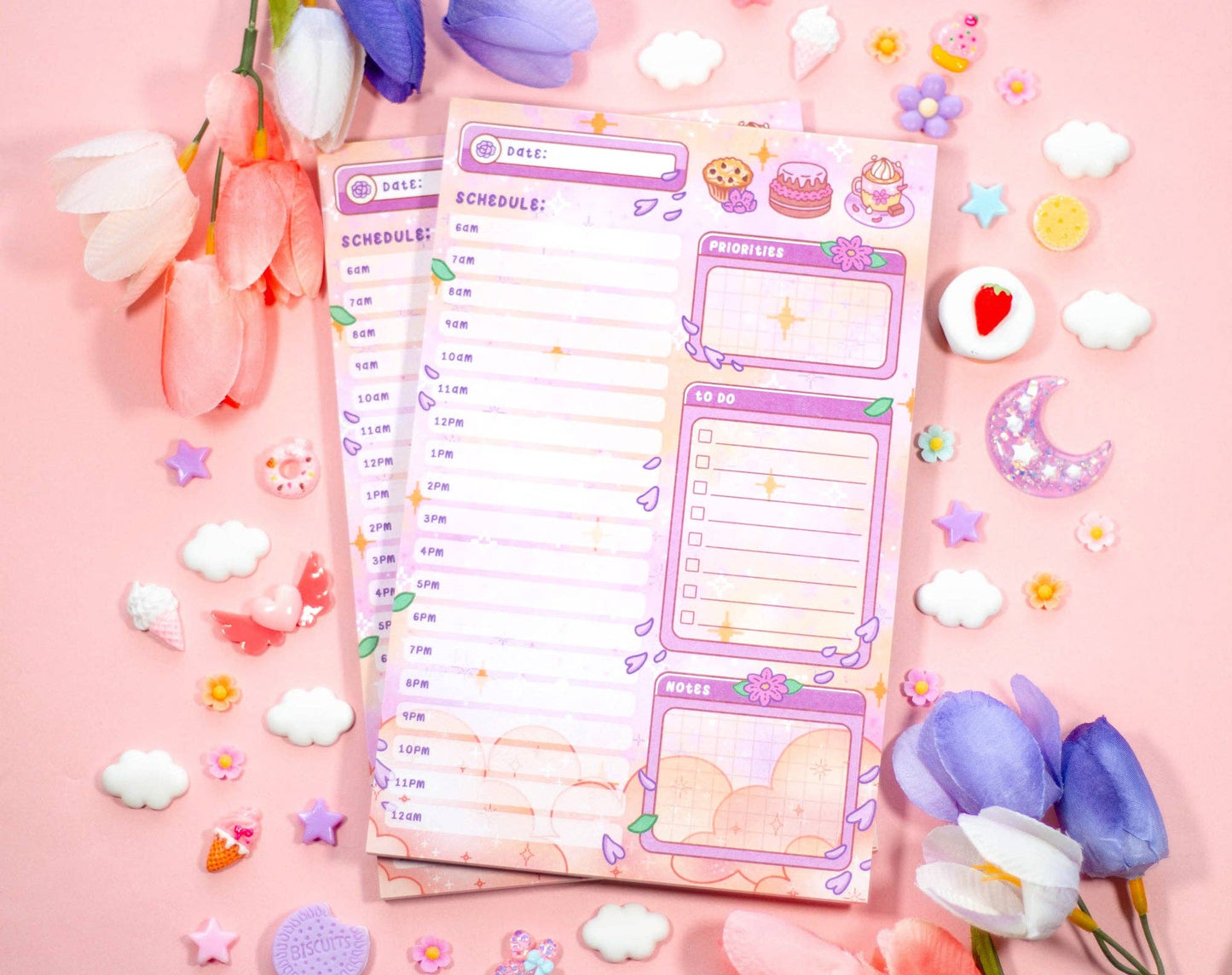 Two colorful planners with a pink background and decorative elements.