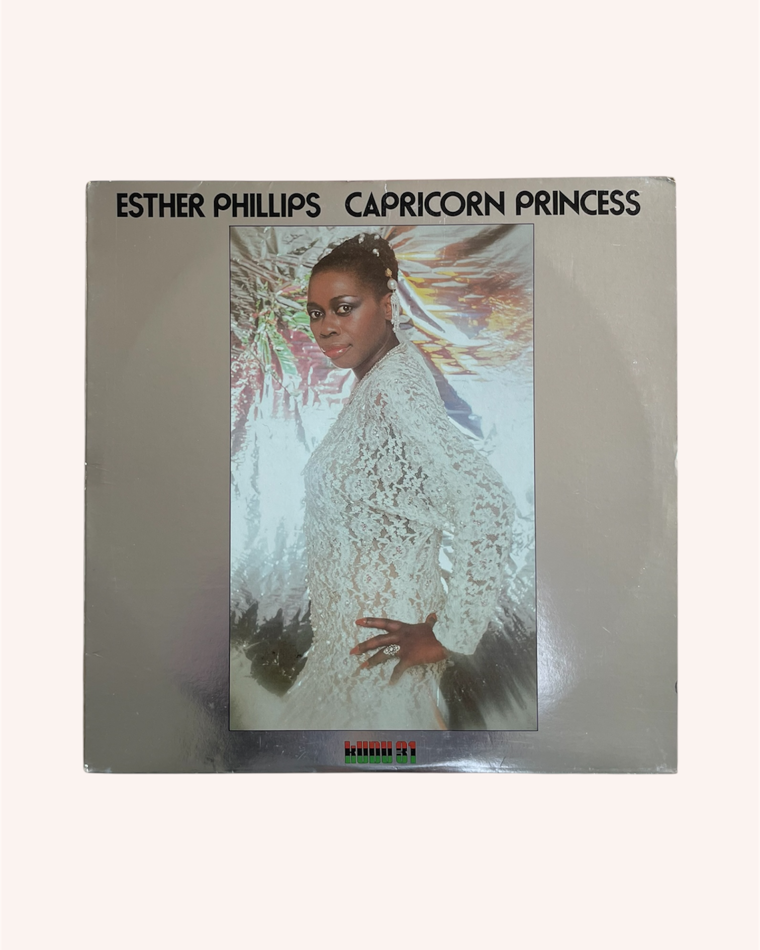 Album cover of 'Capricorn Princess' by Esther Phillips with a person in a white dress on a silver background. Capricorn Princess Vinyl Record - Esther Phillips