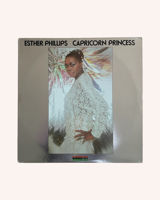 Album cover of 'Capricorn Princess' by Esther Phillips with a person in a white dress on a silver background. Capricorn Princess Vinyl Record - Esther Phillips