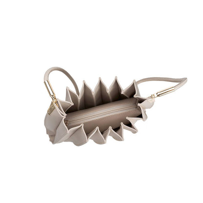 Beige handbag with unique design on a white background, Carrie Pleated Shoulder Bag, Melie Bianco