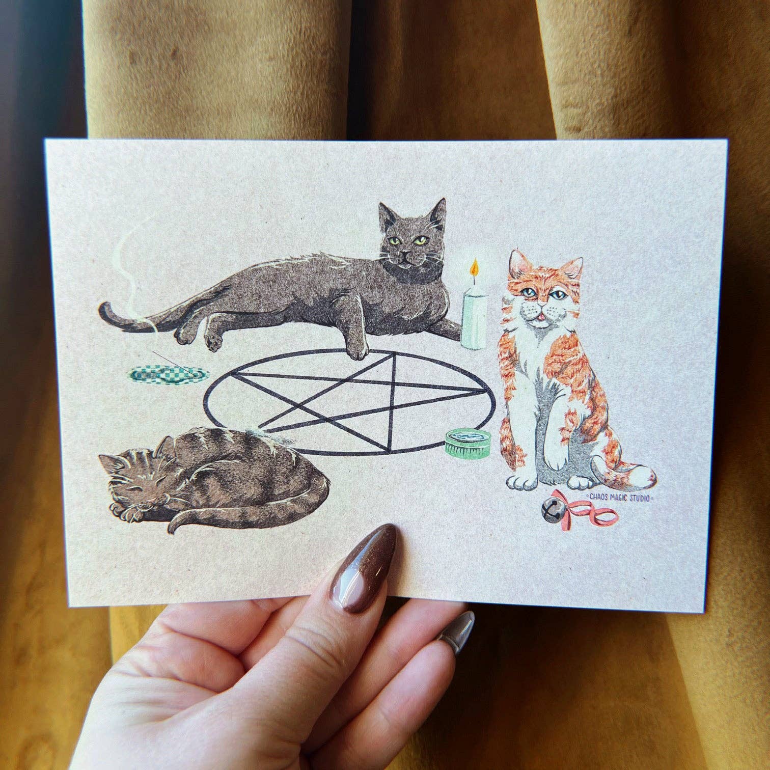 Art print with illustrations of cats and a pentagram held by a hand. Cat Coven Art Print, Chaos Magic Studio