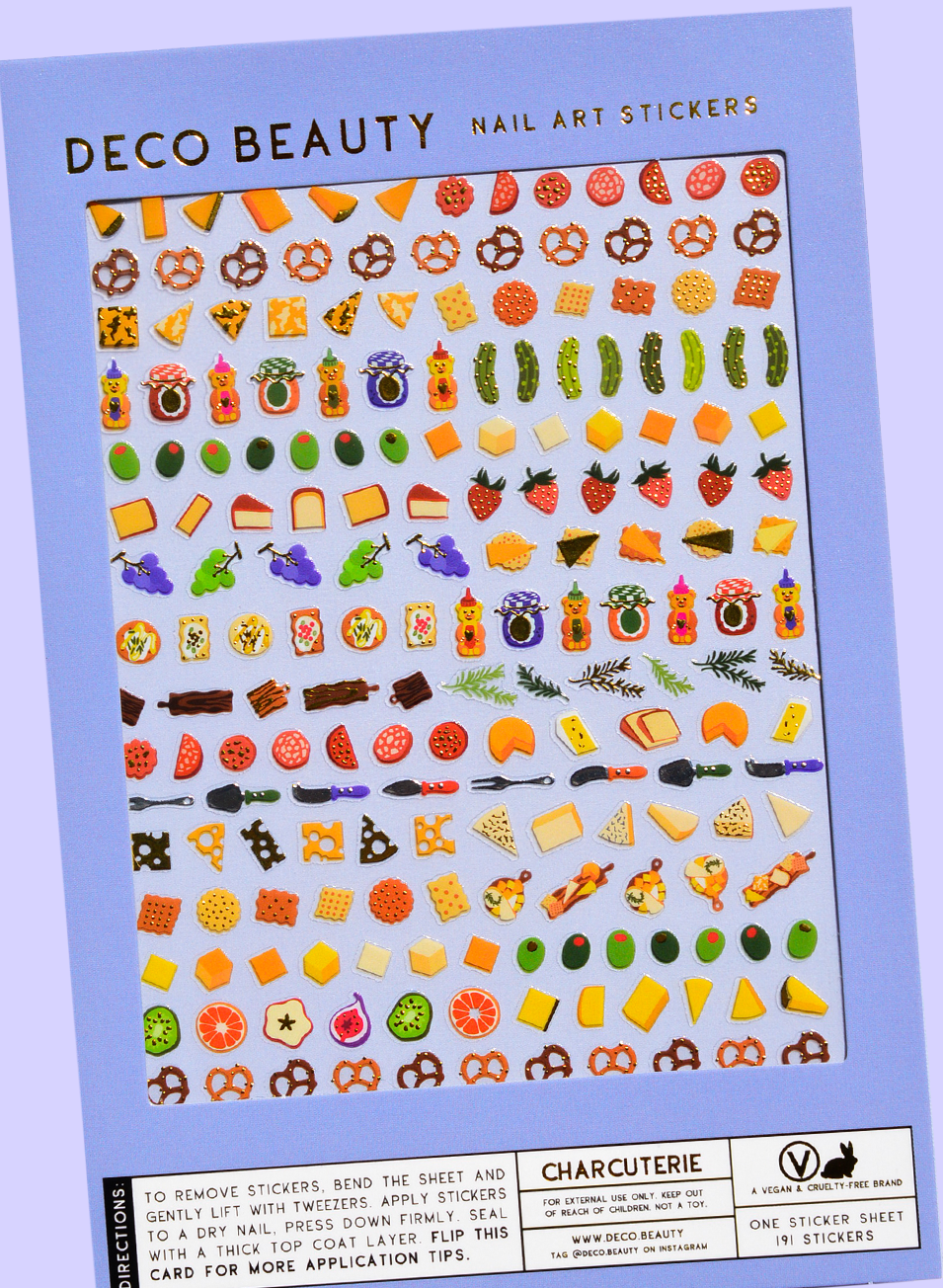 Sheet of Deco Beauty nail art stickers with various food-themed designs on a blue background. Charcuterie Nail Art Stickers