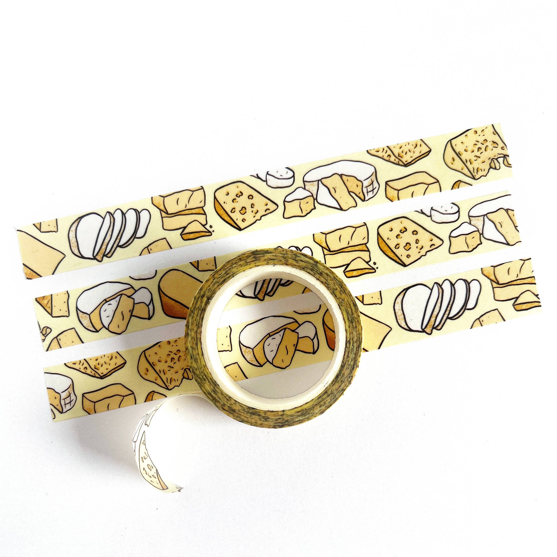 Roll of tape with cheese pattern on a white background