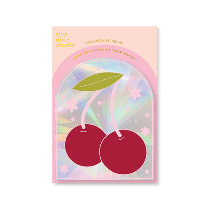 Suncatcher decal packaging with cherry design on a pastel background