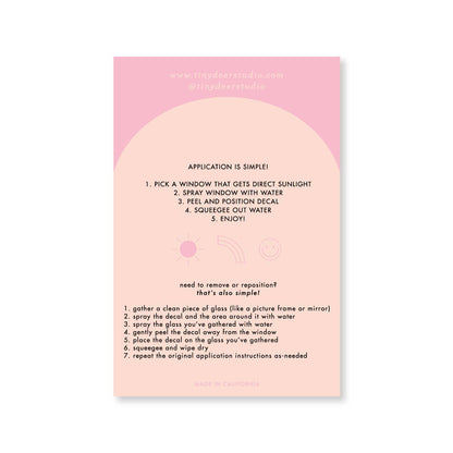 Instructions for window decal application on a pink background