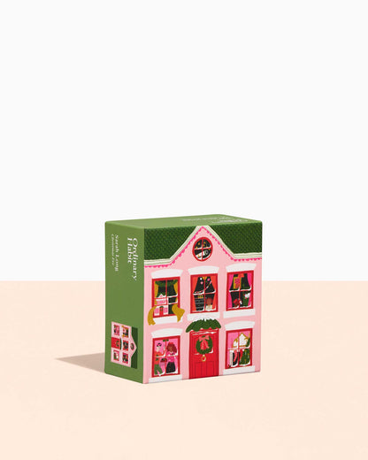 Dollhouse-shaped product packaging on a white background