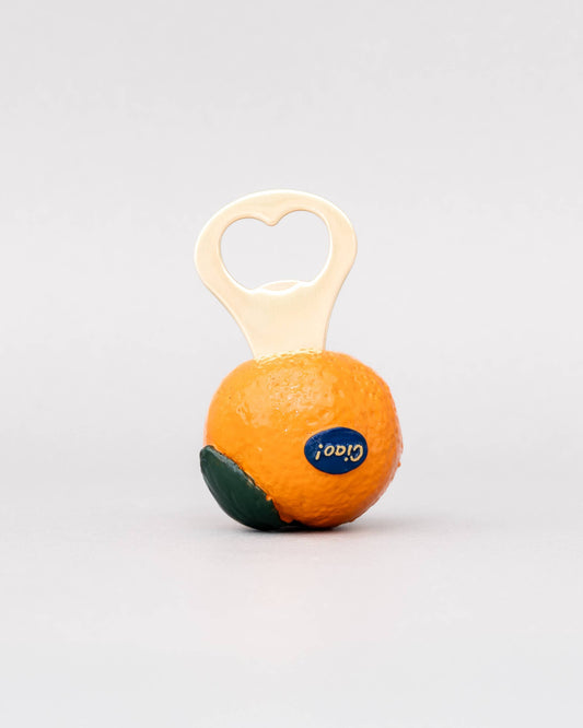 Orange and green baby rattle with a wooden handle on a white background