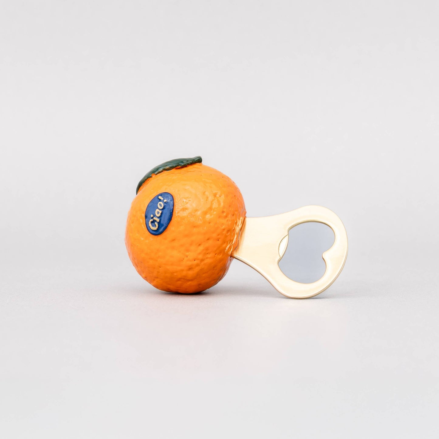 An orange-shaped bottle opener with a white handle and a blue C&H logo, set against a plain light gray background.