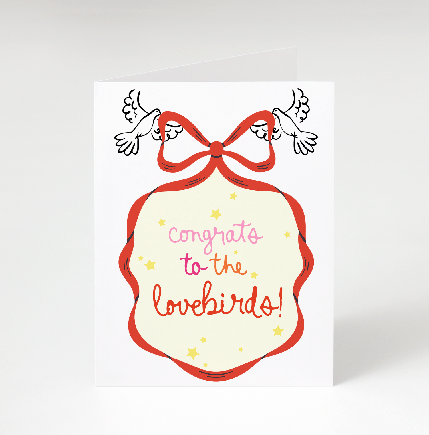 Card with 'Congrats to the lovebirds!' text and a red bow on a white background