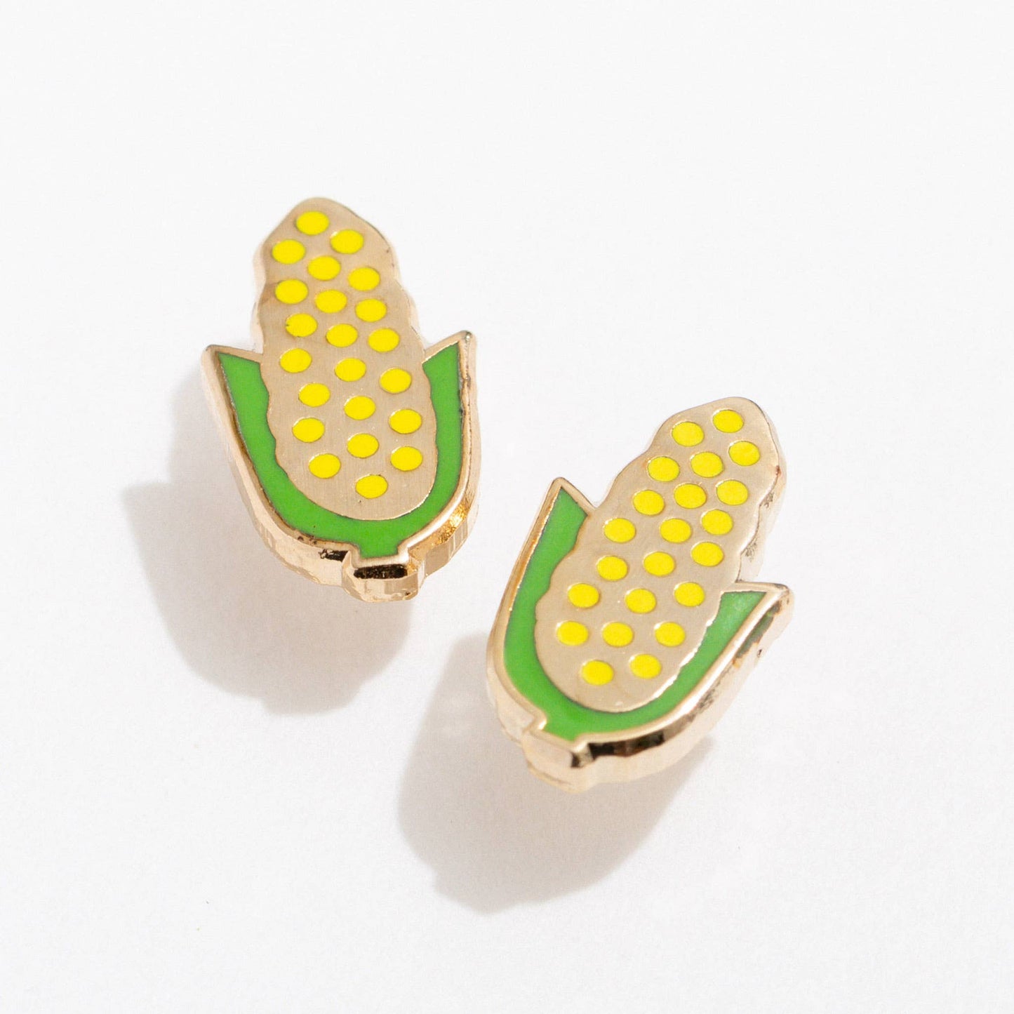 Corn-shaped earrings on a white background, Corn on the Cob Enamel Stud Earrings Larissa Loden