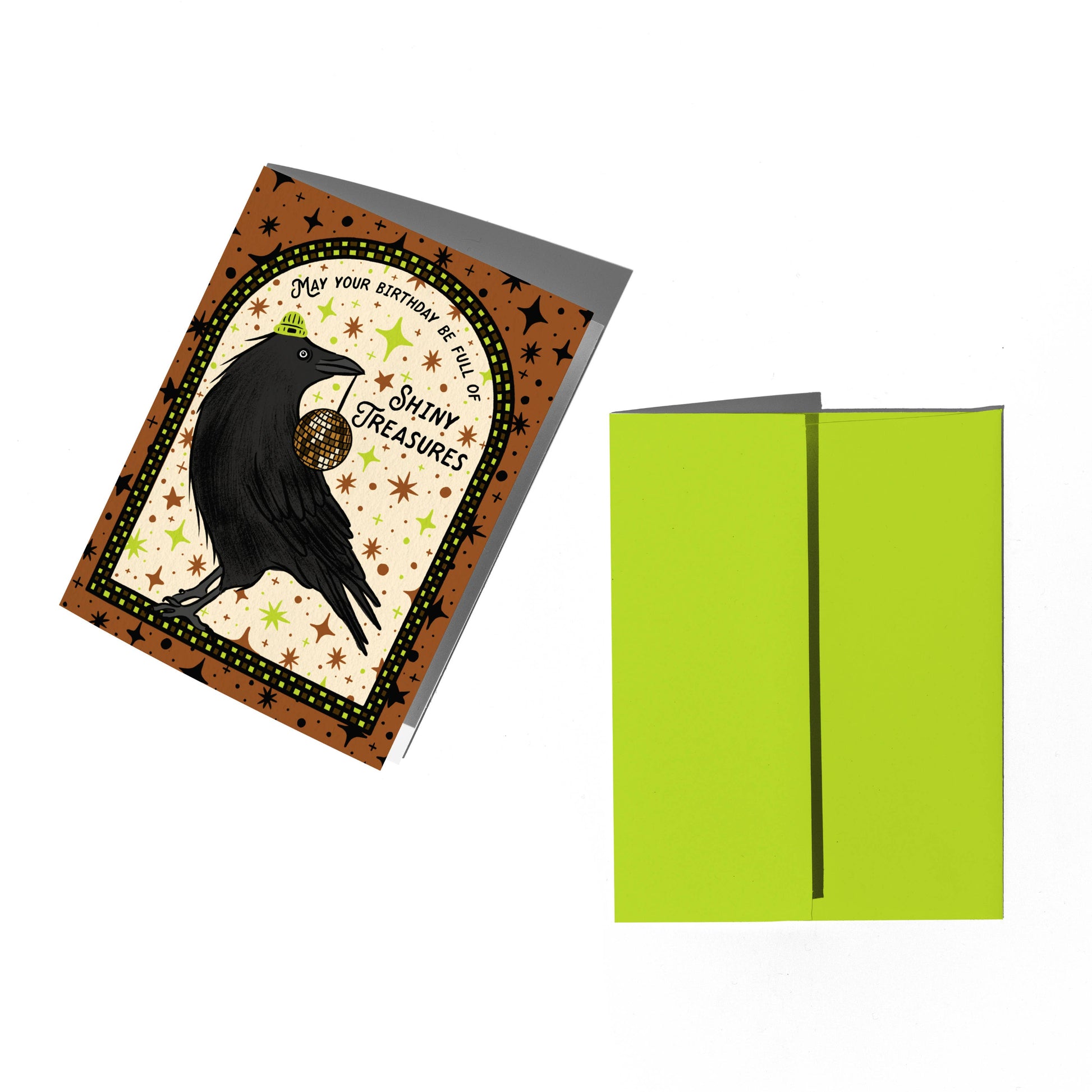 Greeting card with a black crow design and a green envelope on a white background