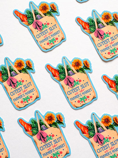 Stickers of a shopping bag with vegetables and flowers, labeled 'Cutest Slut at the Farmer's Market'.