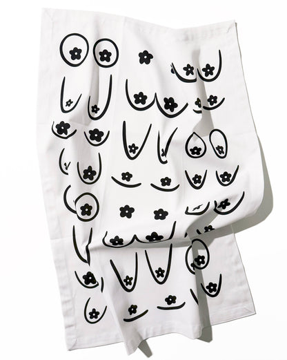 White towel with black abstract designs on a white background, Daisy Boob Kitchen Tea Towel