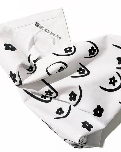 White bandana with black floral patterns on a white background