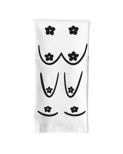 White towel with black floral designs on a white background, Daisy Boob Kitchen Tea Towel