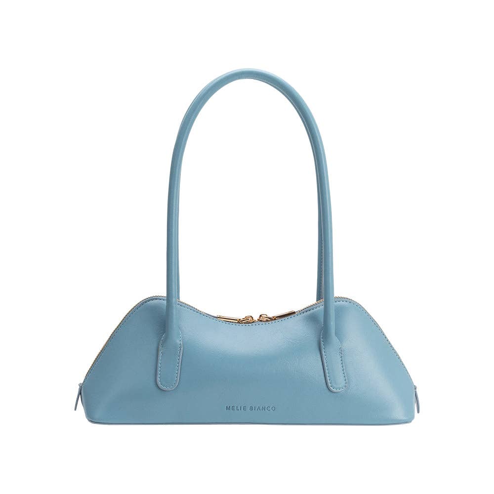 Light blue handbag with a gold zipper on a white background