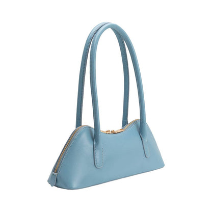 Light blue handbag with a gold zipper on a white background