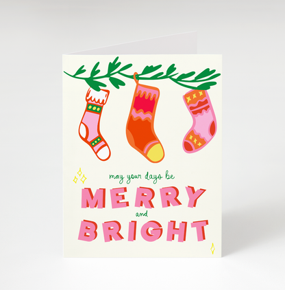 Christmas card with colorful stockings and festive text on a white background