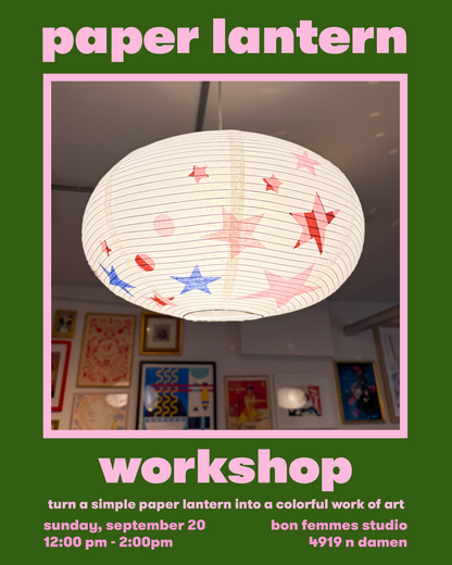 Promotional graphic for a paper lantern workshop, featuring a photo of a white paper lantern with red and blue star patterns inside a pink-bordered frame on a dark green background with pink text reading 'paper lantern' and 'workshop'.