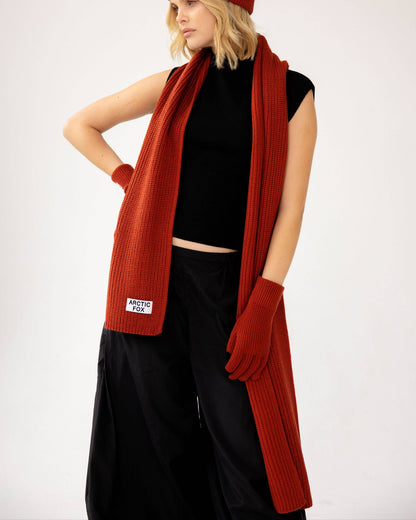 Person wearing a red scarf, hat, and gloves on a white background, Deep Terracotta Recycled Bottle Gloves