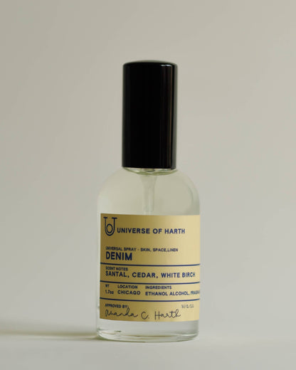 Perfume bottle labeled 'Denim' by Universe of Harth on a light gray background, Denim Room, Space and Body Spray