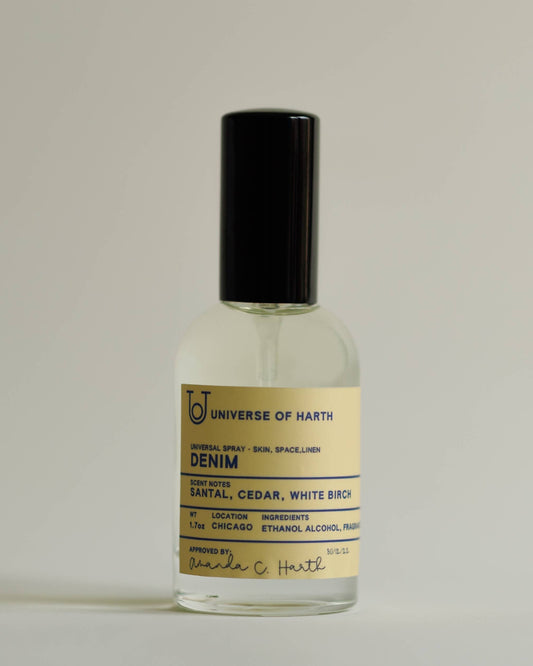 Perfume bottle labeled 'Denim' by Universe of Harth on a light gray background, Denim Room, Space and Body Spray