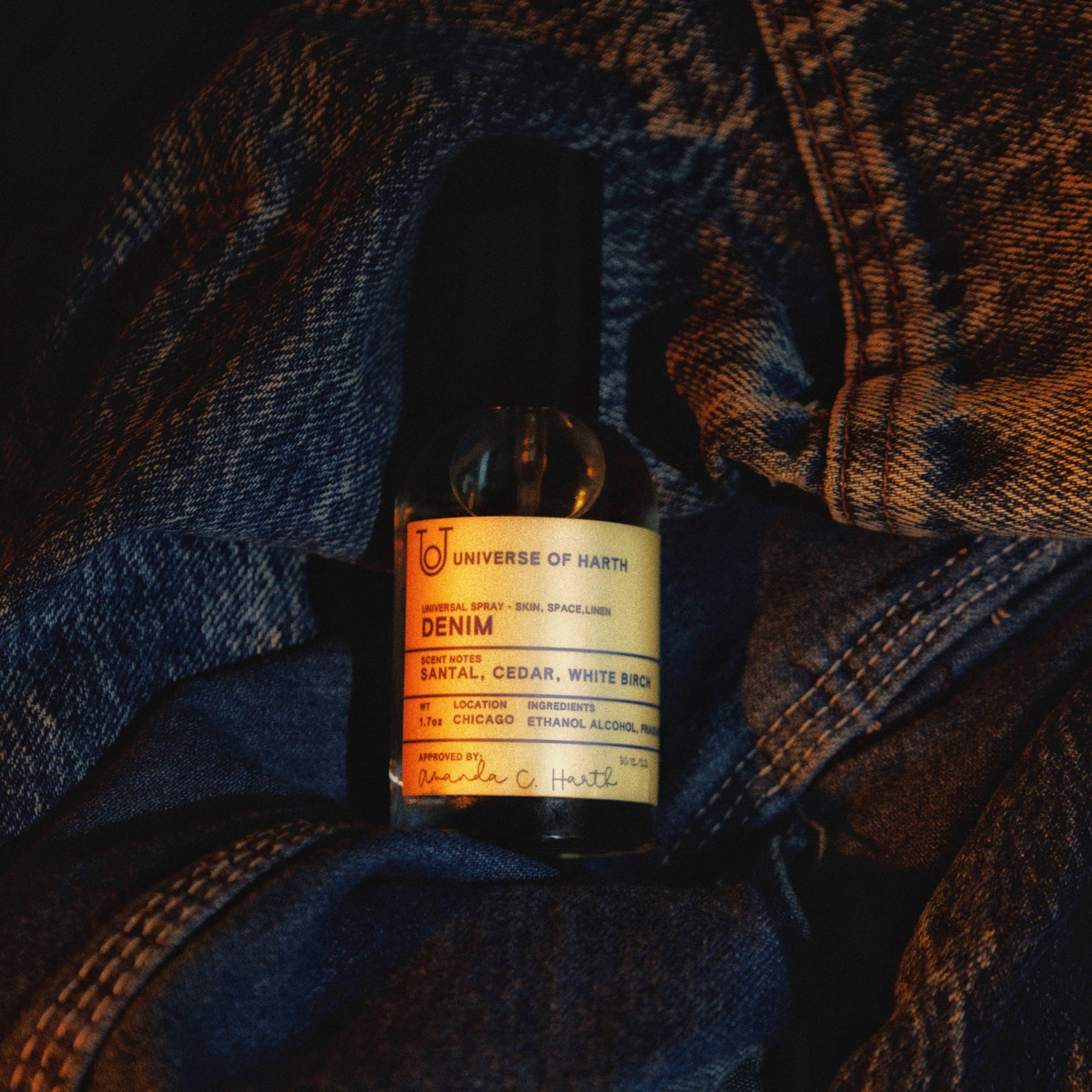 Bottle of Denim cologne on a denim surface, Denim Room, Space and Body Spray