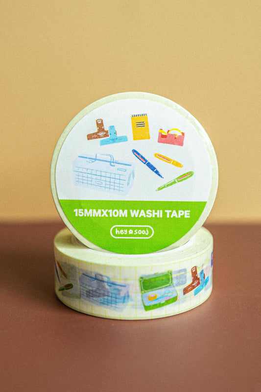 Roll of washi tape with a colorful label on a brown background