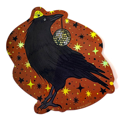 Black crow holding a disco ball on a brown background with stars