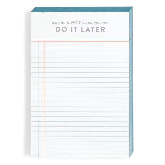 Notepad with grid paper and motivational text on a white background