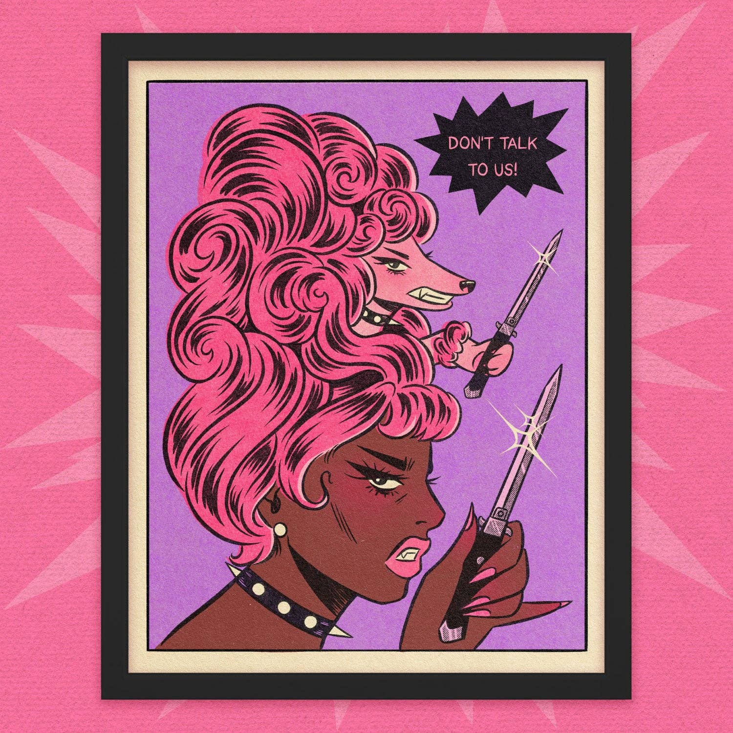 A framed pop-art print featuring two illustrated women with pink hair and knives, with a black starburst reading 'DON'T TALK TO US!' on a purple background, set against a pink patterned backdrop.