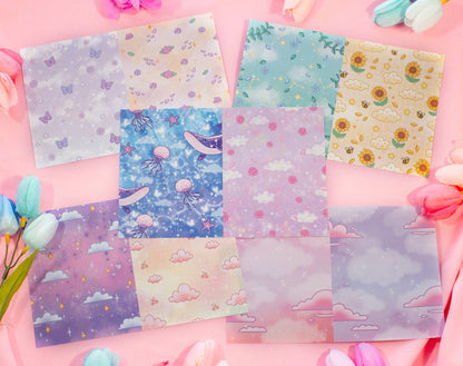 Set of colorful stationery sheets with various patterns on a pink background