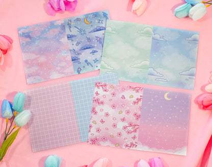 Set of colorful stationery sheets with various designs on a pink background