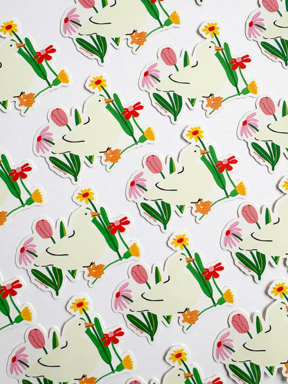 Pattern of cartoon ducks with flowers on a white background