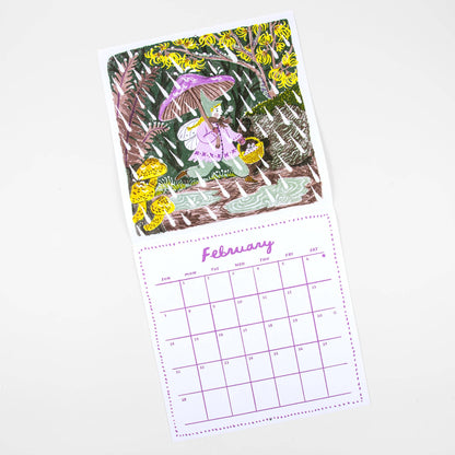 A printed calendar page for February with an illustrated cover showing a woman under a purple umbrella in a forest of yellow flowers, above a purple calendar grid on a white page.