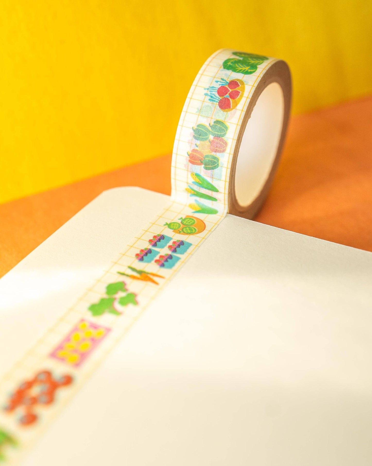Decorative tape with colorful designs on a yellow and orange background, Farmers Market Washi Tape