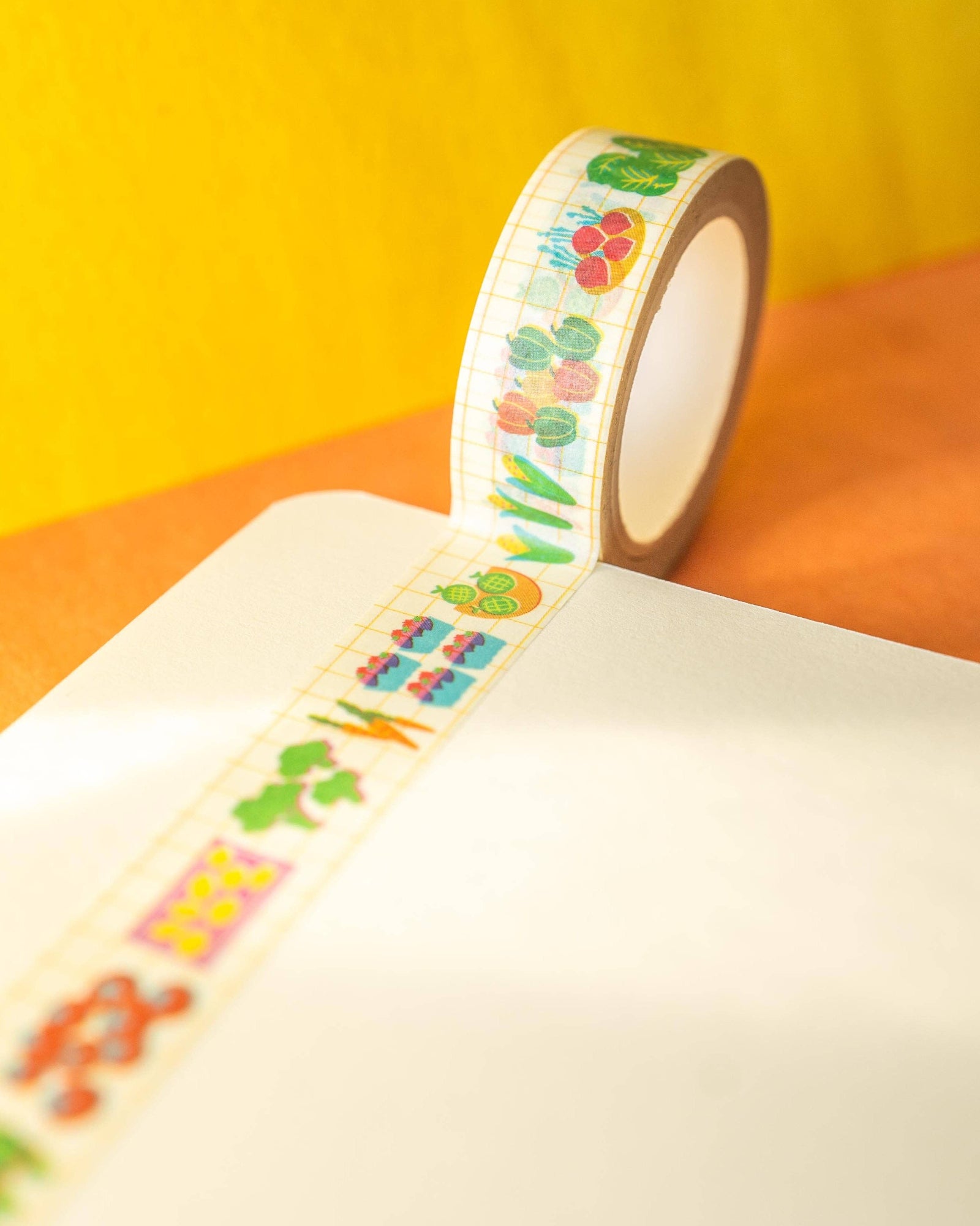 Decorative tape with colorful designs on a yellow and orange background, Farmers Market Washi Tape