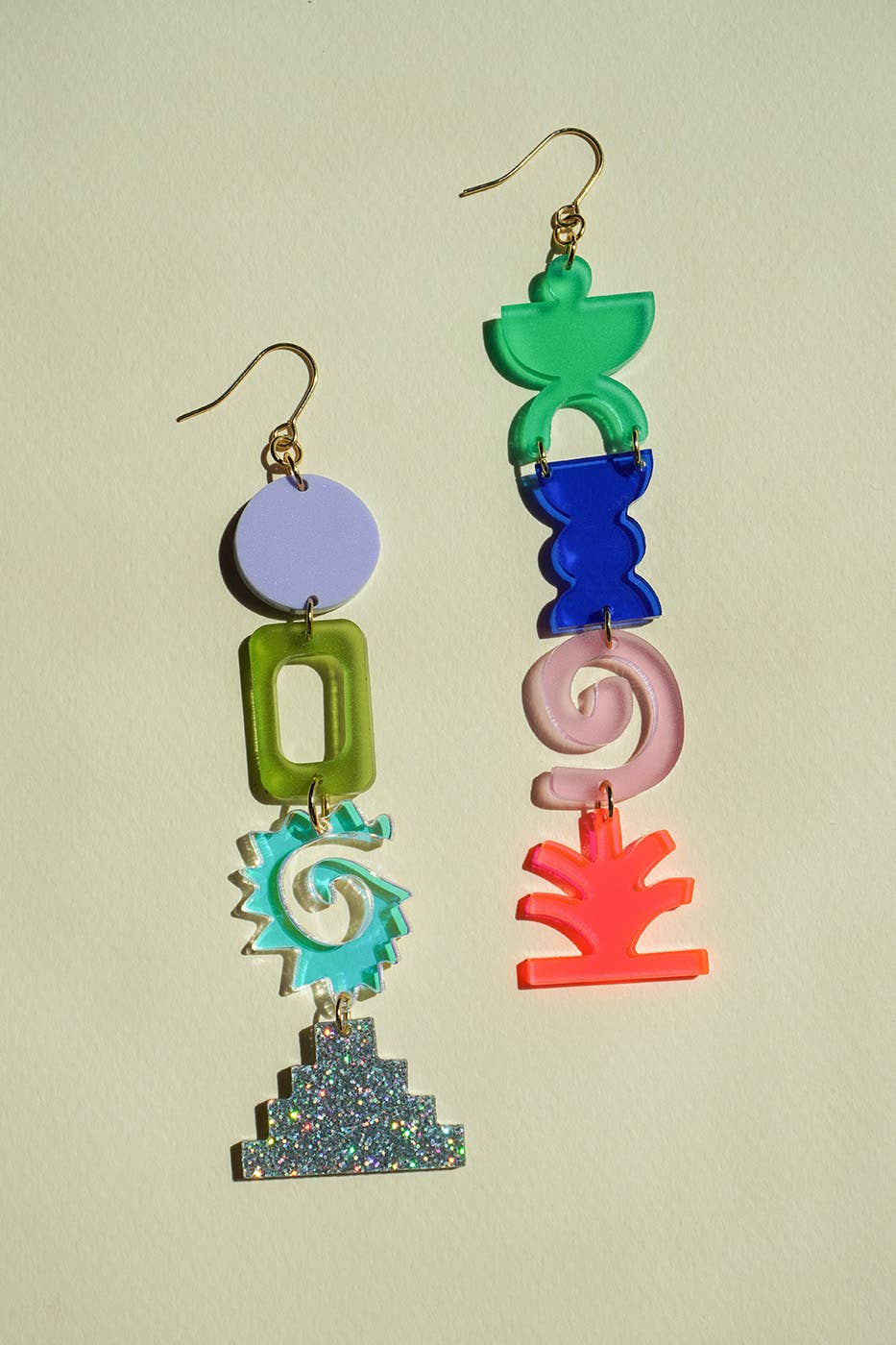 Colorful geometric earrings on a light background