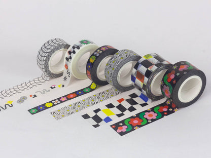 Assorted rolls of decorative tape with various patterns on a white background