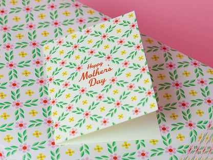 Floral-patterned card with 'Happy Mother's Day' text on a matching background