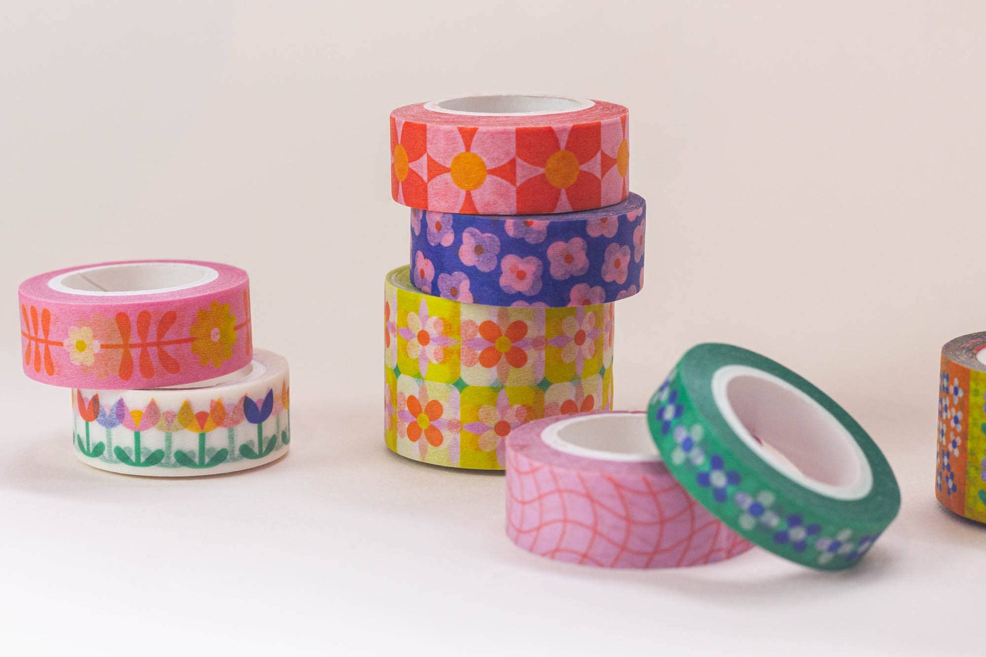 Colorful washi tape rolls on a white background