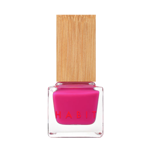 Pink nail polish bottle with wooden cap on a white background