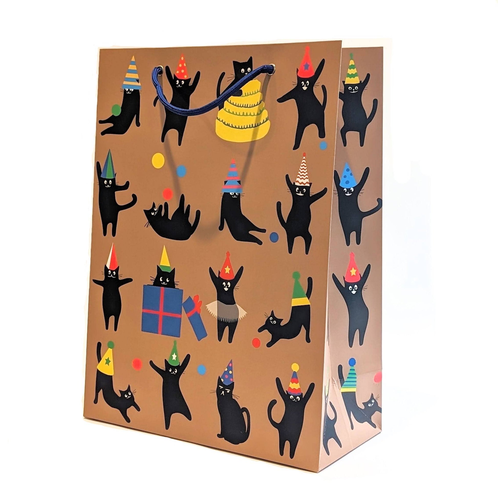 Gift bag with black cats wearing party hats and holding presents on a brown background