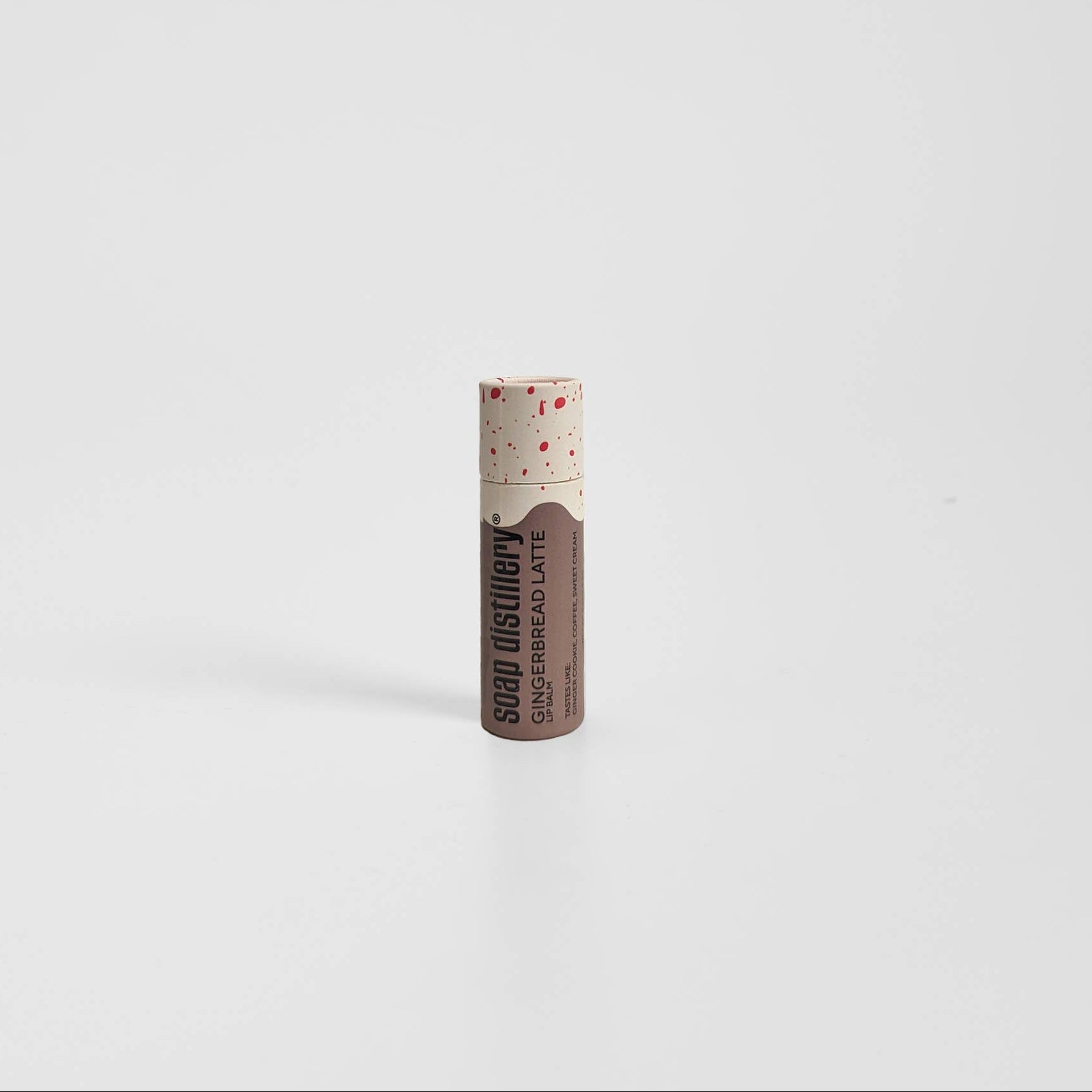 Lip balm with visible brand name on a white background, Gingerbread Latte Lip Balm