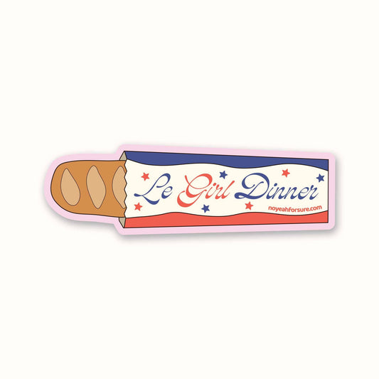 Sticker shaped like a hot dog with 'Le Girl Dinner' text on a white background
