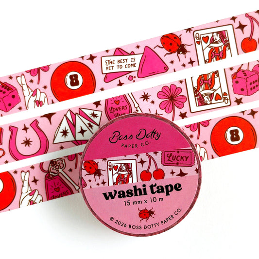 Pink washi tape with decorative designs and a circular container labeled 'Boss Dotty Paper Co.' on a white background.