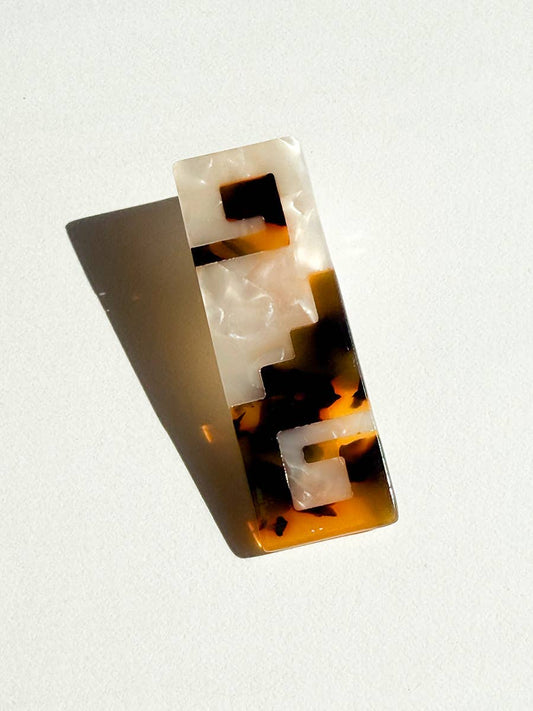 Tortoiseshell patterned keycap on a white background